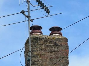 Chimney sweeping in Sheffield cowls on chimney